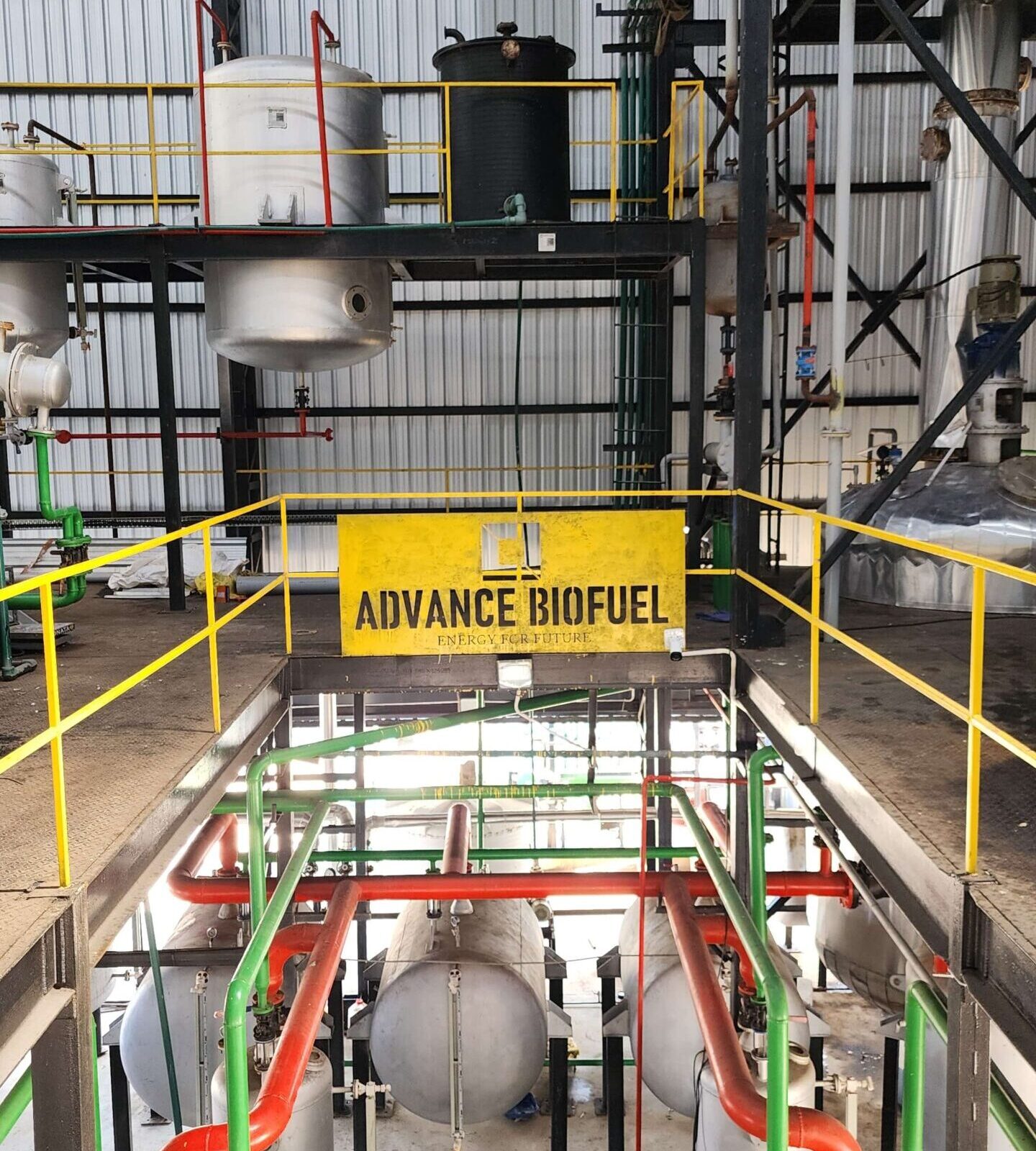 Advance Biofuel team working on sustainable biodiesel production technology in a state-of-the-art facility.